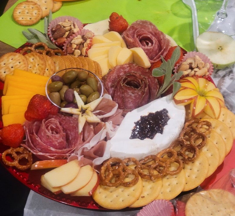 Participants worked together during a December charcuterie class to create a seasonal board.